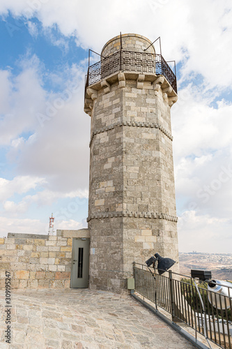 The minaret and the mosque roof of the Muslim part of the grave of the prophet Samuel on Mount of Joy near Jerusalem in Israel photo