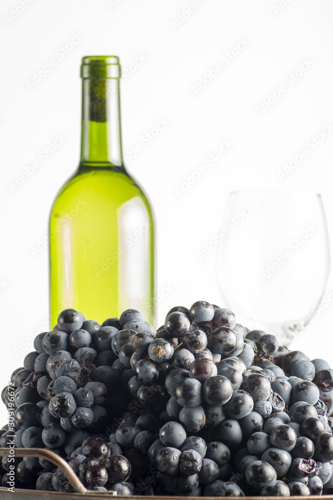Red wine grape in dark metal tray.