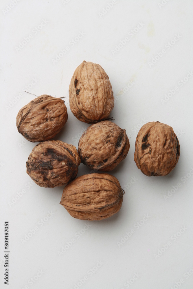 Garlic walnuts in color background Garlic walnuts in color background