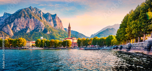 Beautiful morning cityscape of central park of Lecco town, Italy, Europe. Colorful summer sunrise on Como lake. Traveling concept background. photo