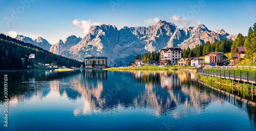 Panoramic morning view of Misurina village, National Park Tre Cime di Lavaredo, Location Auronzo, Dolomiti Alps, South Tyrol, Italy, Europe. Colorful summer scene of Misurina lake. photo