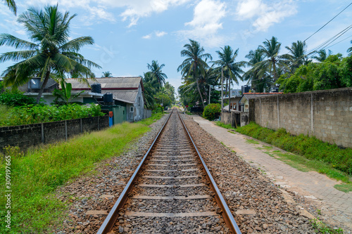 Hikkaduwa, Sri Lanka. March 1, 2018. Railroad among tropical vegetation.