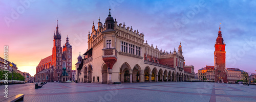 Panorama of Medieval Main market square with Basilica of Saint Mary, Cloth Hall and Town Hall Tower in Old Town of Krakow at sunrise, Poland photo