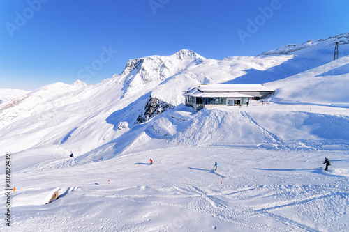 Men Skiers and snowboarders Cable car station on Hintertux Glacier