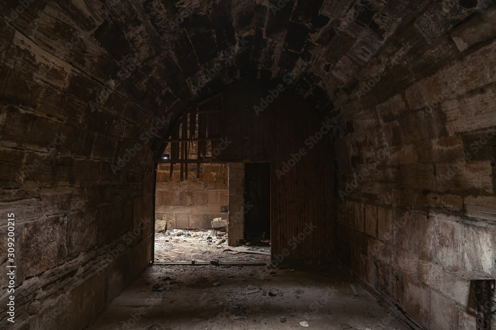 Mystical interior of dark corridor in an old abandoned palace