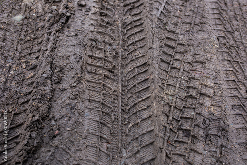 trace of car on earth texture photo