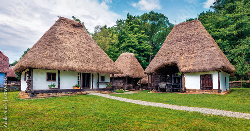 Vászonkép Panoramic summer view of traditional romanian peasant houses