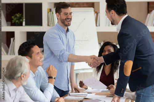 Photos Successful business partners shaking hands starting or finished meeting