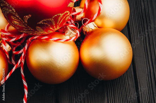Colored christmas decorations on black wooden table. Xmas balls on wooden background. Top view, copy space. new year.