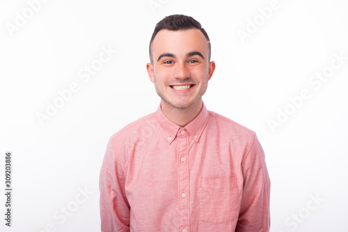 Close up portrait of happy smiling man looking at the camera