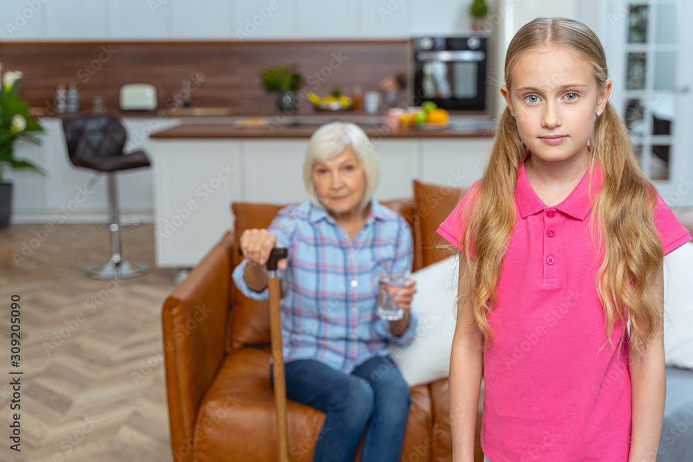 Senior lady sitting with a glass of water Senior lady sitting with a glass of water