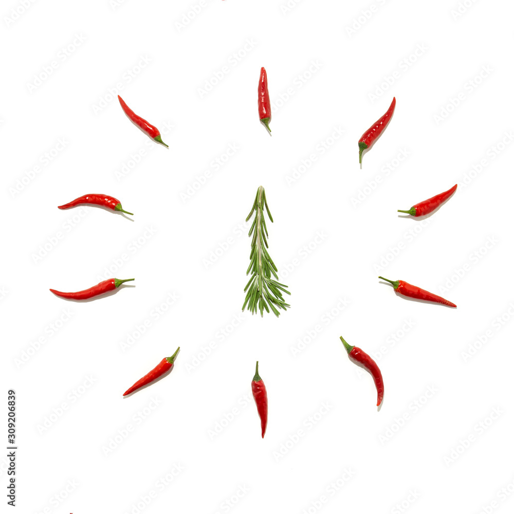 Abstract Christmas background in the form of a clock and a fir tree made of rosemary and chili pepper on a white background. Food concept, Christmas minimalism Abstract Christmas background in the form of a clock and a fir tree made of rosemary and chili pepper on a white background. Food concept, Christmas minimalism