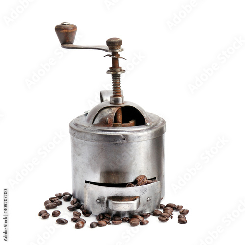 Vintage hand manual coffee grinder coffee grinder and coffee beans isolated on white background.