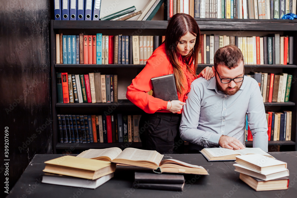 a man with a woman in the library prepared for the exam read books a man with a woman in the library prepared for the exam read books