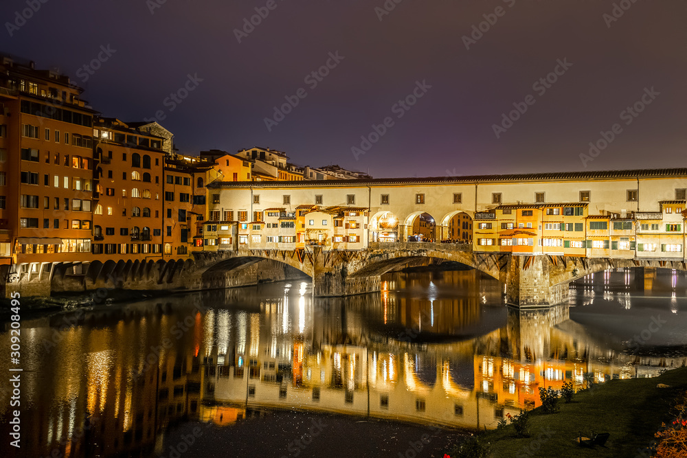 Ponte Vecchio over Arno river at night in Florence