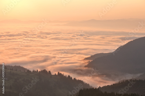 Clouds in mountains at sunrise