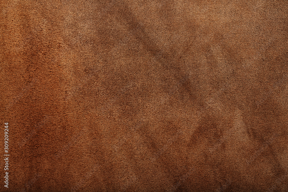 Brown skin texture close up as background. In full screen. Brown skin texture close up as background. In full screen.