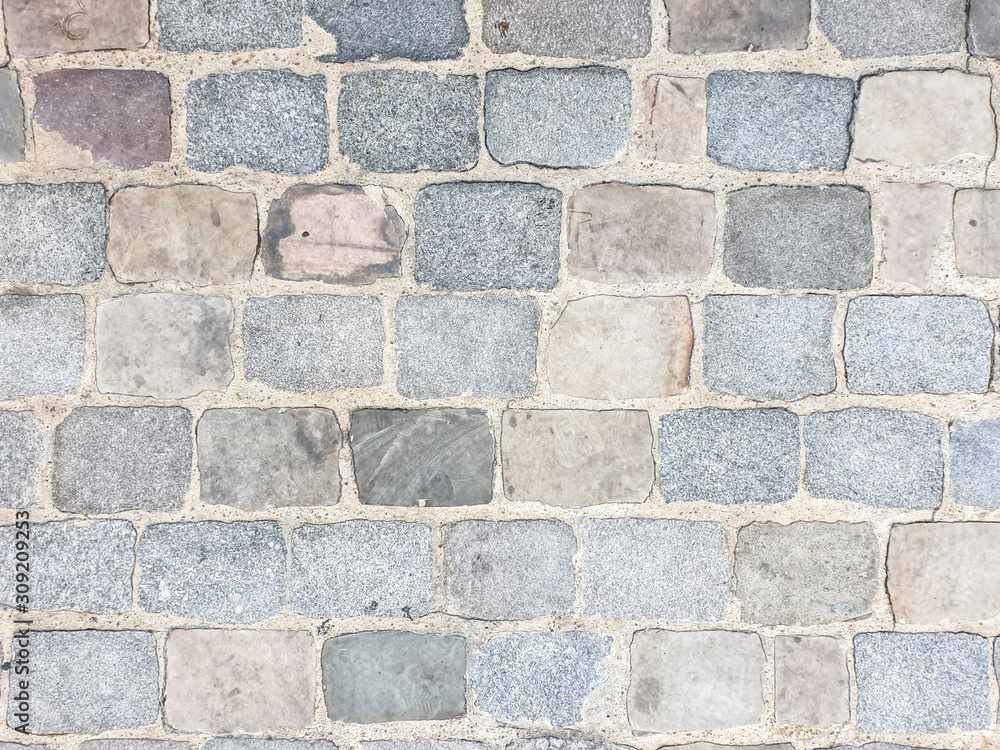 Naklejka premium Arrière-plan texture pavés de béton gris