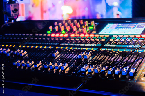 Closeup of an audio mixing control panel photo