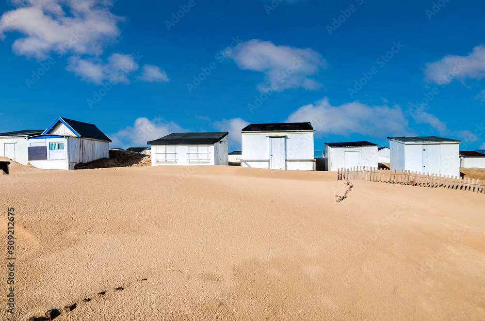 pretty landscape with beach cabins on the coast in northern France pretty landscape with beach cabins on the coast in northern France