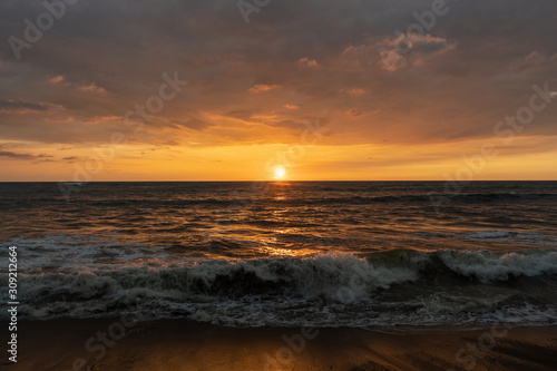 Fototapeta Naklejka Na Ścianę i Meble -  Beautiful sunset on the shore of the Indian Ocean