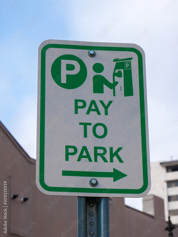 Pay to park sign in the downtown of New Orleans, USA. Pay to park sign in the downtown of New Orleans, USA.