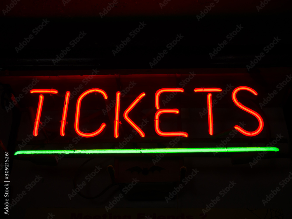 Obraz premium Glowing red neon tickets sign
