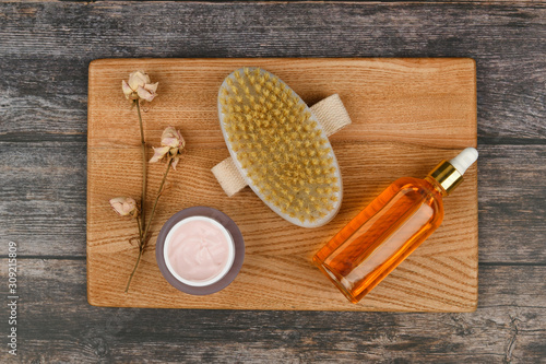Skin care products on a wooden background. Anti-cellulite massage brushes. view from above. Massage brush. Accessories for massage. Flatley. eco care concept. Skin care products on white.