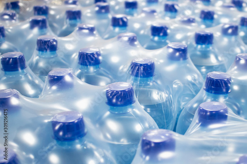 Water in plastic bottles.
