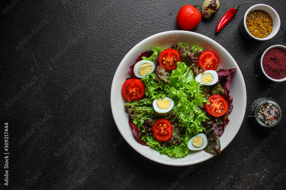 healthy salad vegetables, quail eggs (tomato, lettuce and other ingredients) menu concept. food background. top view. copy space