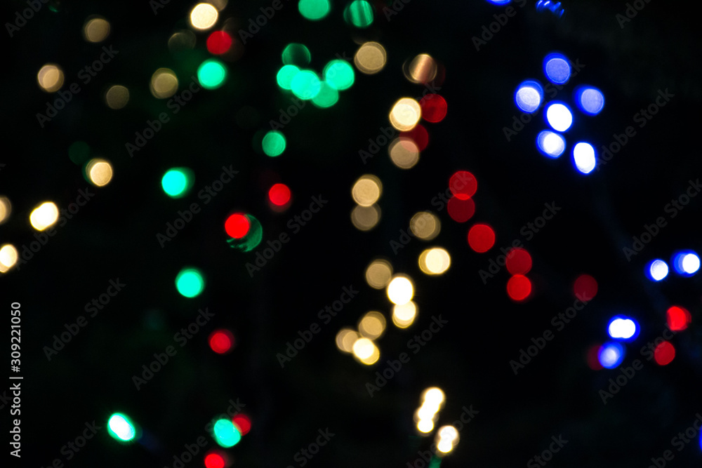 Bright colorful christmas bokeh isolated on black background, Xmas tree light texture, new year holiday decoration
