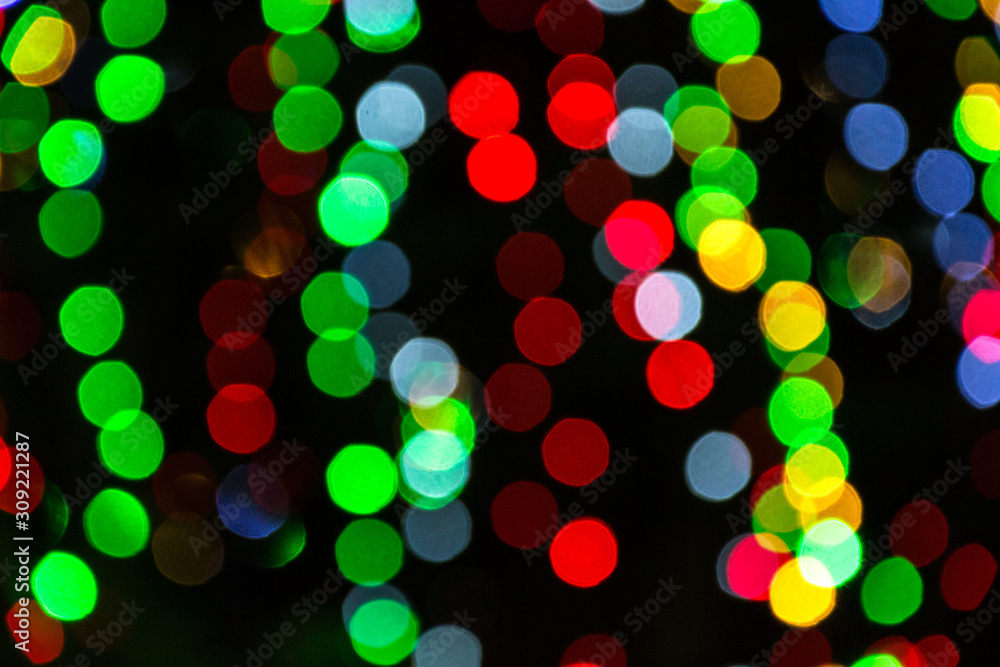 Bright colorful christmas bokeh isolated on black background, Xmas tree light texture, new year holiday decoration