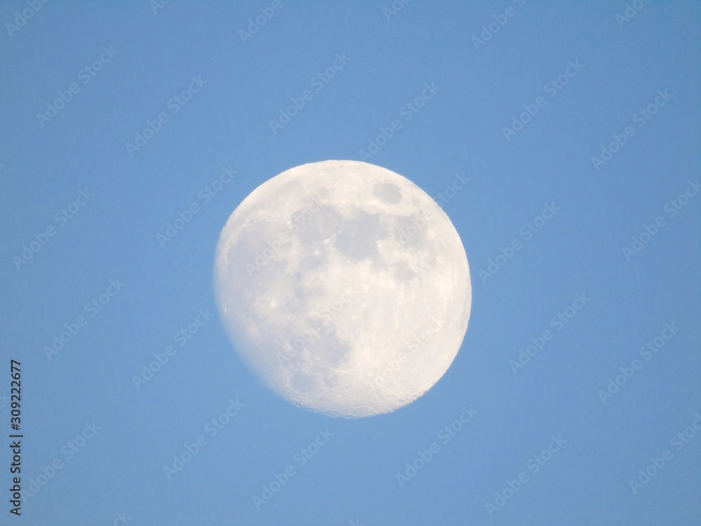 Beautiful caption of the moonlight by day with an incredible blue sky in the background. Beautiful caption of the moonlight by day with an incredible blue sky in the background.