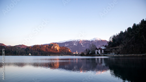 Sunrise view of lake Bled in winter with the castle and town