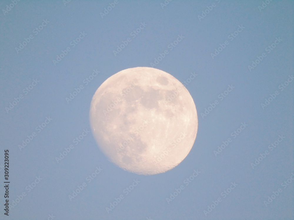 Beautiful caption of the moonlight by day with an incredible blue sky in the background. Beautiful caption of the moonlight by day with an incredible blue sky in the background.