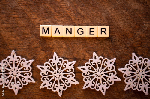the word Manger on wood