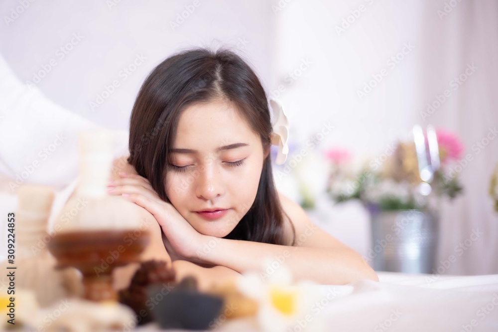 Asian Beautiful, young and healthy woman in spa salon. Massage treatment spa room . Traditional medicine and healing concept. Asian Beautiful, young and healthy woman in spa salon. Massage treatment spa room . Traditional medicine and healing concept.