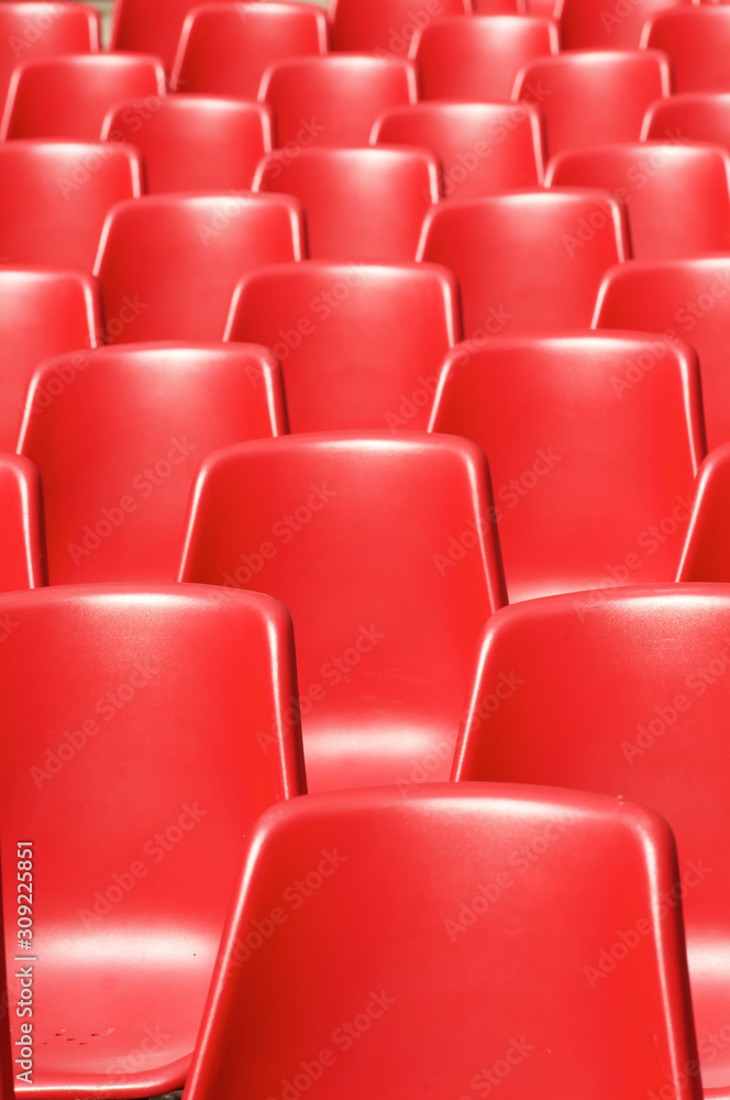 Naklejka premium Red plastic chairs