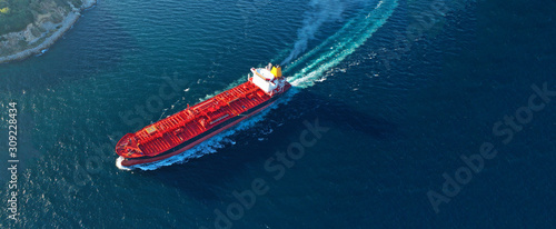 Aerial drone ultra wide panoramic photo of industrial crude oil tanker cruising open ocean deep blue sea photo