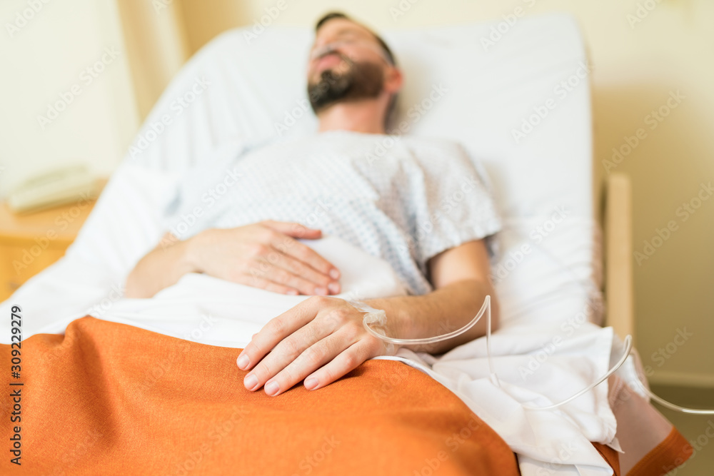 Patient With Iv Drip Suffering On Hospital Bed Patient With Iv Drip Suffering On Hospital Bed
