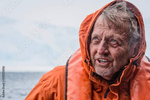 Close up of man in hooded life jacket photo