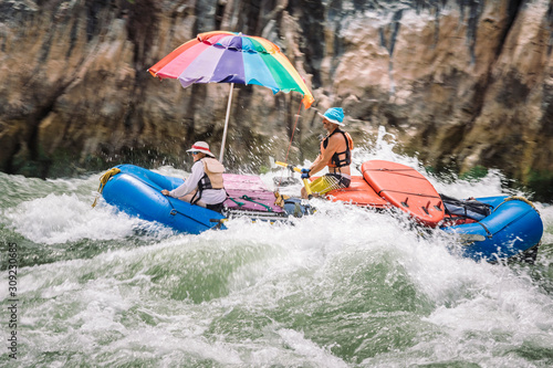 People on a raft through Specter Rapid, Colorado River, Grand Canyon National Park, Arizona, USA photo