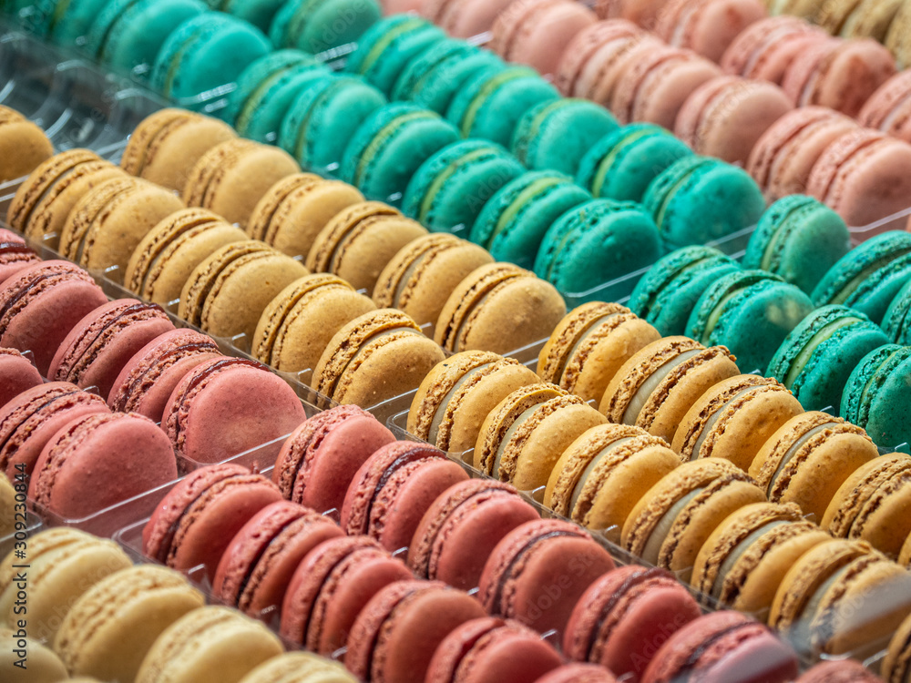 Macarones French pastries, colored in pastel tones.