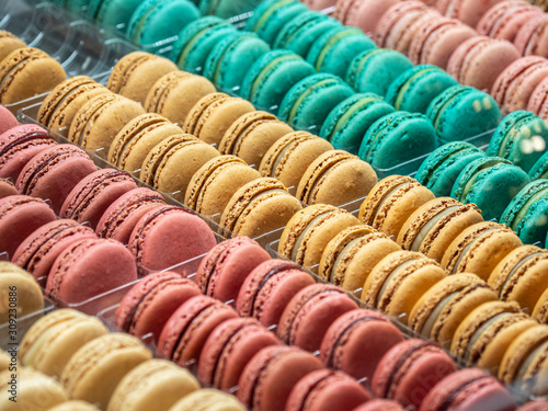 Macarones French pastries  colored in pastel tones.