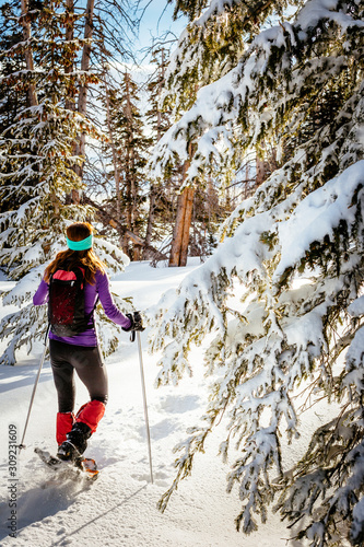 Sabina Allemann is  hiking wearing snowshoes in Cedar Breaks National Monument. photo