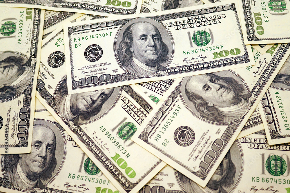 One hundred dollar banknotes background.