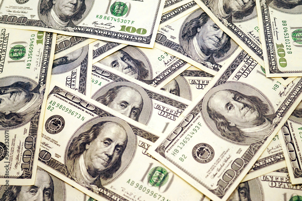 One hundred dollar banknotes background.