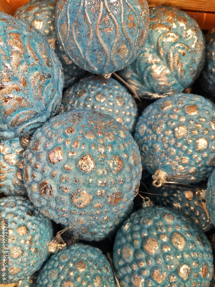 Curly Christmas balls for home decoration. Christmas ball background. Top view. New year decoration. Christmas sparkling decoration balls. Glittering balls for new year tree. Selective focus. Curly Christmas balls for home decoration. Christmas ball background. Top view. New year decoration. Christmas sparkling decoration balls. Glittering balls for new year tree. Selective focus.