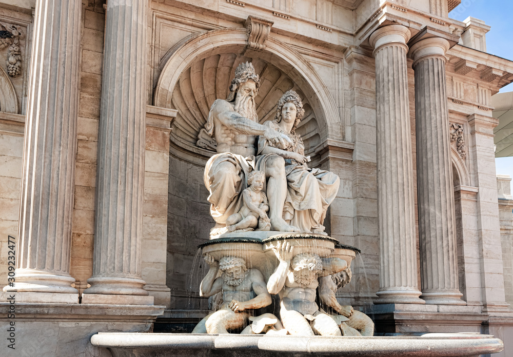 Statues of Neptune fountain at Albertina Museum on Albertinaplatz Vienna