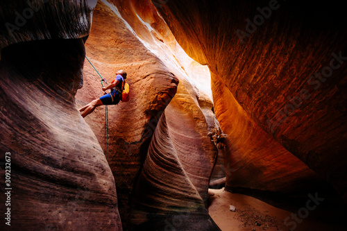 Woman rappelling in Keyhole Canyon